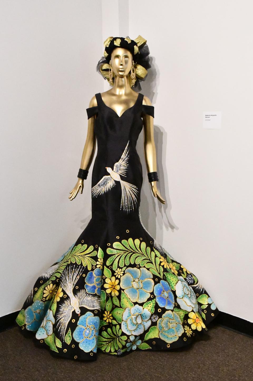 An embroidered haute couture dress by Roberto Mojardin on display at the Hecho en Colorado exhibit at El Pueblo History Museum in Pueblo, Colo.