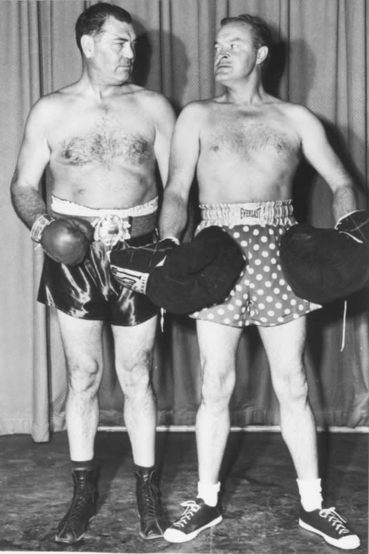 Bob Hope (R), who had a brief amateur boxing career, is ready to take on former heavyweight champion Jack Dempsey for a television skit in 1951. On September 22, 1927, Dempsey muffed a chance to regain the heavyweight championship when he knocked down Gene Tunney but failed to go to a neutral corner. UPI File Photo