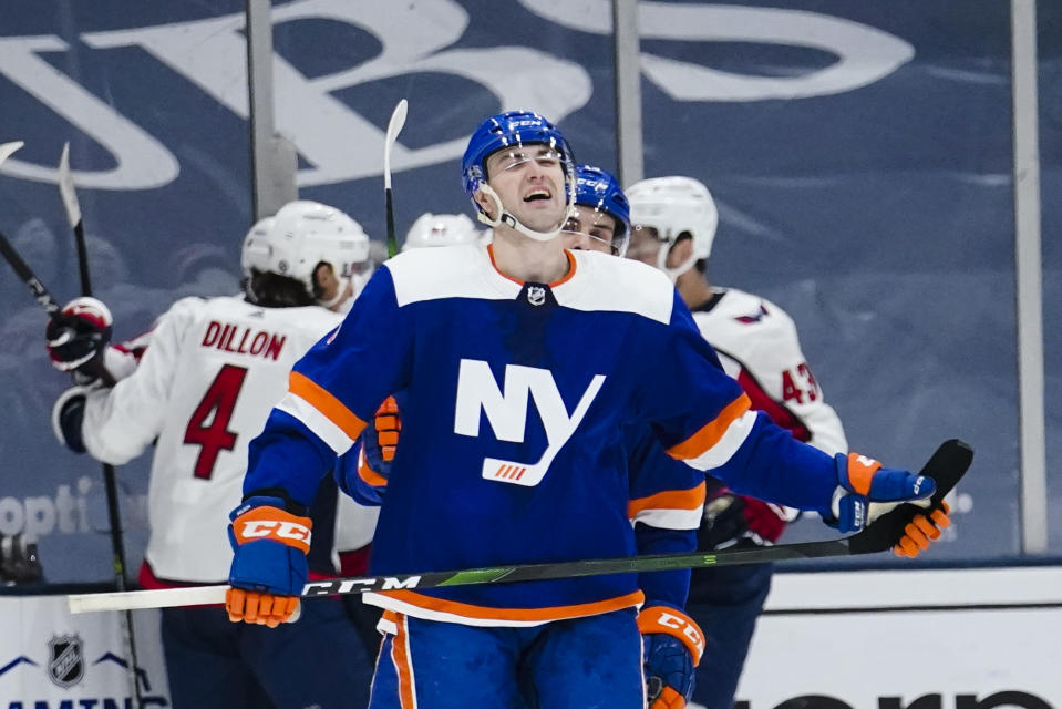 New York Islanders' Adam Pelech reacts as the Washington Capitals celebrate a goal by Daniel Sprong during the second period of an NHL hockey game Saturday, April 24, 2021, in Uniondale, N.Y. (AP Photo/Frank Franklin II)