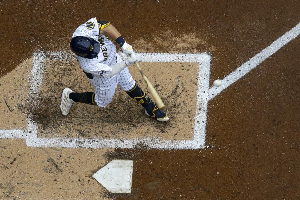 Milwaukee Brewers' Keston Hiura hits a home run during the third inning of a baseball game against the Colorado Rockies Sunday, June 27, 2021, in Milwaukee. (AP Photo/Morry Gash)