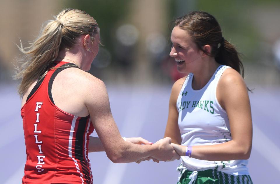 Wall's Lexi Slaughter, right, congratulates Shallowater's Makki Hart after the 400 meters at the Region I-3A track and field meet Monday, April 22, 2024, at Elmer Gray Stadium in Abilene.