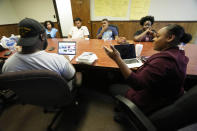 Arekia Bennett-Scott, 30, executive director of Mississippi Votes, discusses elections, race and voter fatigue, with young student and community social activists, Oct. 25, 2023, in Jackson, Miss. (AP Photo/Rogelio V. Solis)