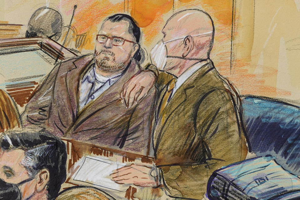 Artist sketch depicts Guy Reffitt, joined by his lawyer William Welch, right, in federal court in Washington, D.C., on Feb. 28, 2022. 