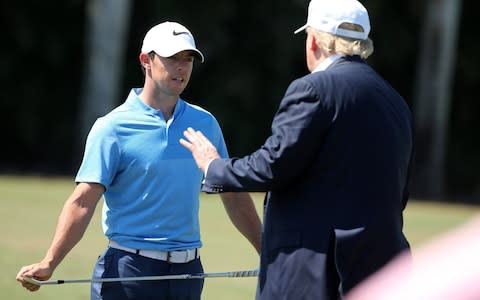 Donald Trump speaks to Rory McIlroy during a tournament at Doral in 2016 - Credit: Mike Ehrmann/Getty