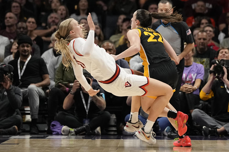 Iowa guard Caitlin Clark drives to the basket past Virginia Tech guard Matilda Ekh during the second half of an NCAA women's college basketball game Thursday, Nov. 9, 2023, in Charlotte, N.C. (AP Photo/Chris Carlson)