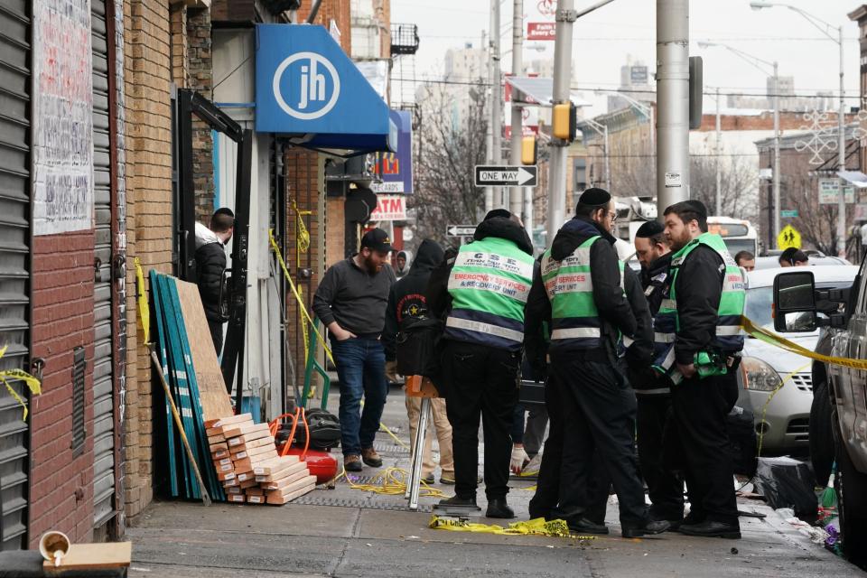 A demolition and recovery crew works at the scene of Tuesday's deadly shooting at a Jewish market in Jersey City, New Jersey. (Photo: BRYAN R. SMITH via Getty Images)