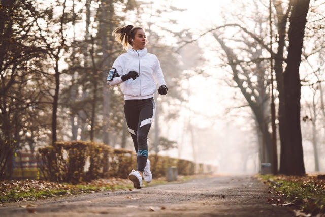 Outdoor Sport Exercises, Sporty Outfit Ideas. Woman Wearing Warm Sportswear  Getting Ready Before Exercising, Running Jogging Outside During Winter.  Stock Photo, Picture and Royalty Free Image. Image 94891005.