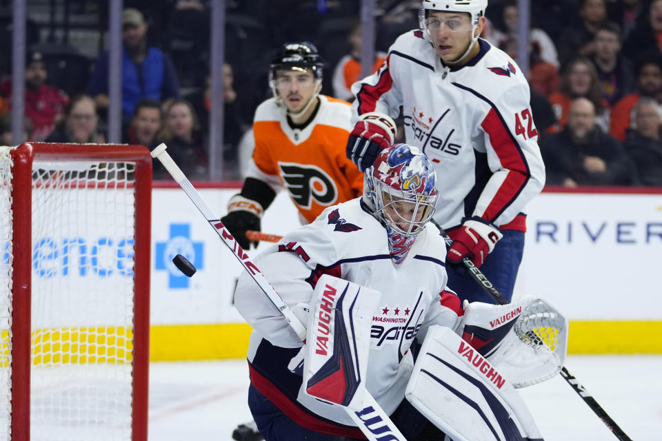 Washington Capitals' Darcy Kuemper deflects a shot during the second period of an NHL hockey game against the Philadelphia Flyers, Wednesday, Jan. 11, 2023, in Philadelphia. (AP Photo/Matt Slocum)