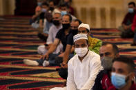 Muslim worshippers wearing masks to help stop the spread of the coronavirus, attend to offer Eid al-Adha prayer while maintaining a social distance at the Mohammad al-Amin Mosque in Beirut, Lebanon, Friday, July 31, 2020. Eid al-Adha, or Feast of Sacrifice, Islam's most important holiday marks the willingness of the Prophet Ibrahim to sacrifice his son. (AP Photo/Hassan Ammar)