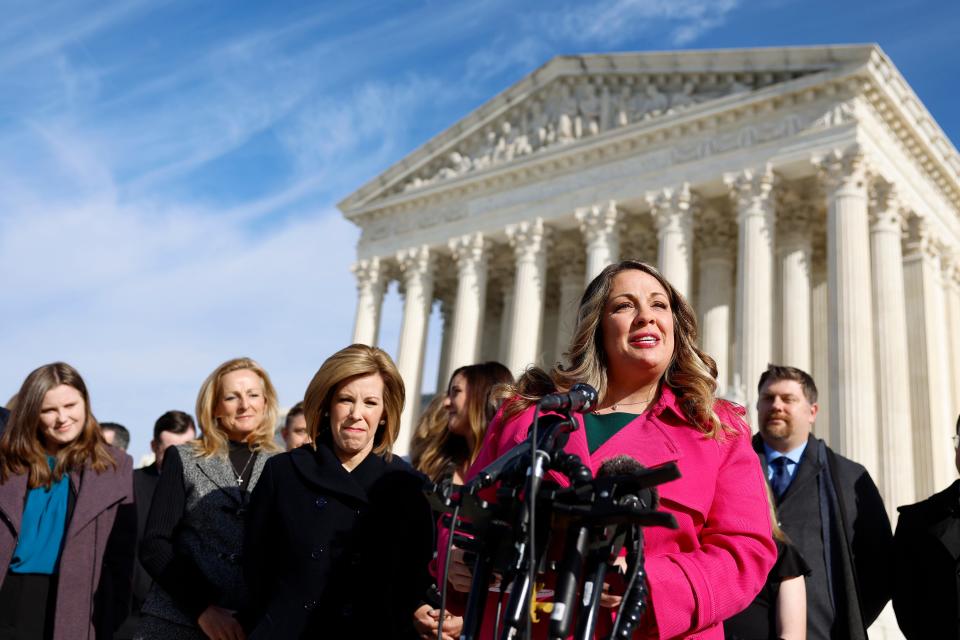 Lorie Smith, the owner of 303 Creative, speaks to reporters outside the U.S. Supreme Court on Dec. 05, 2022.