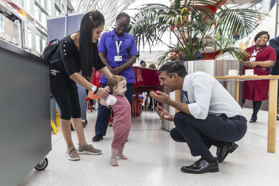 Prime Minister Rishi Sunak visits the Evelina Children's ward at St Thomas' hospital to take part in a NHS Big Tea celebration to mark the 75th anniversary of the NHS, in central London, Tuesday July 4, 2023.. (Jack Hill/Pool Photo via AP)