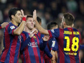 Barcelona's Lionel Messi (C), Luis Suarez (L) and Jordi Alba celebrate a goal against Cordoba during their Spanish First division soccer match at Camp Nou stadium in Barcelona December 20, 2014. REUTERS/Albert Gea