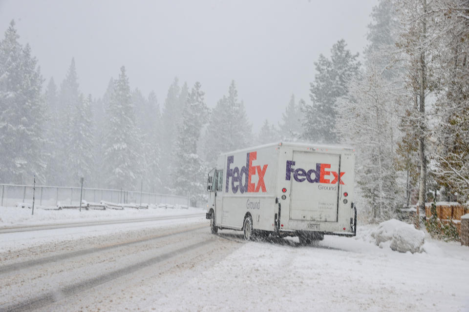 CALIFORNIA, USA - NOVEMBER 8: A FedEx truck is seen as snow blanked South Lake Tahoe in California, United States on November 8, 2022. Winter Storm warning in effect for Lake Tahoe and Nevada mountains. (Photo by Tayfun Coskun/Anadolu Agency via Getty Images)