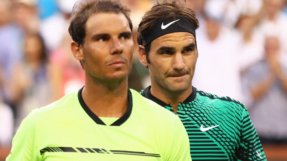 Rafael Nadal and Roger Federer. (Photo by Clive Brunskill/Getty Images)