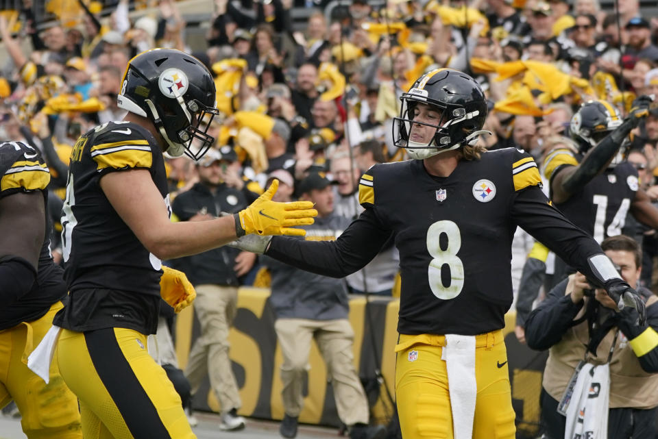 Pittsburgh Steelers quarterback Kenny Pickett (8) is congratulated by tight end Pat Freiermuth (88) after diving cross the goal to score against the New York Jets during the second half of an NFL football game, Sunday, Oct. 2, 2022, in Pittsburgh. (AP Photo/Gene J. Puskar)