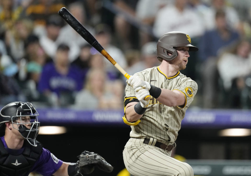 San Diego Padres' Jake Cronenworth follows the flight of his RBI-single off Colorado Rockies starting pitcher Chad Kuhl in the third inning of a baseball game Saturday, Sept. 24, 2022, in Denver. (AP Photo/David Zalubowski)