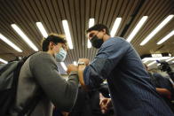 Prime Minister Justin Trudeau greets commuters at a Montreal Metro station on Tuesday, Sept. 21, 2021. Trudeau’s Liberal Party has secured victory in parliamentary elections but failed to get the majority he wanted in a vote that focused on the coronavirus pandemic but that many Canadians saw as unnecessary.(Sean Kilpatrick/The Canadian Press via AP)