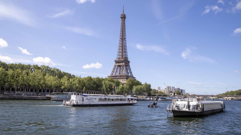 An empty boat travels the River Seine during the technical test event last week for the Paris 2024 opening ceremony. - Catherine Steenkeste/Getty Images