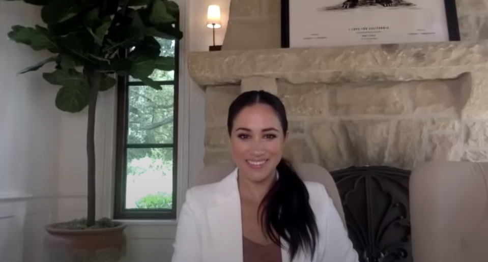 <p>During a chat with members of her patronage <a href="https://www.harpersbazaar.com/celebrity/latest/a33999679/meghan-markle-decor-santa-barbara-home-photo/" rel="nofollow noopener" target="_blank" data-ylk="slk:Smart Works;elm:context_link;itc:0;sec:content-canvas" class="link ">Smart Works</a>, Meghan opted for a bright white blazer, brown tank top, her hair in a low side ponytail, and subtly smoky eye makeup. </p>