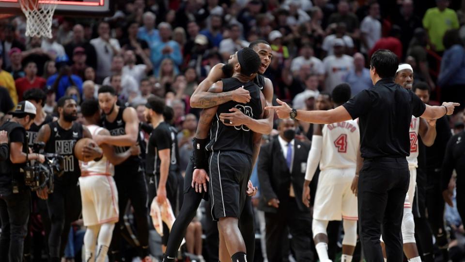 Jan 8, 2023; Miami, Florida, USA; Brooklyn Nets center Nic Claxton (33) hugs forward Royce O'Neale (00) after beating the Miami Heat at FTX Arena. Mandatory Credit: Michael Laughlin-USA TODAY Sports