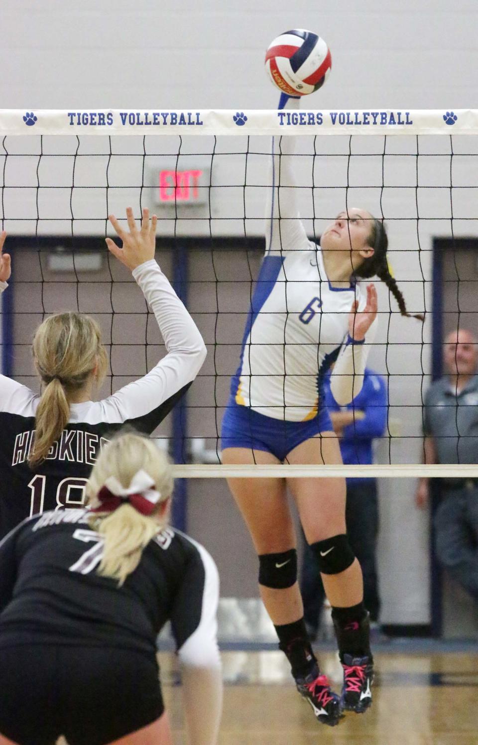 Howards Grove's Ali Schueler (6) leaps to return the ball to New Holstein on Oct. 23, 2014, at Howards Grove.