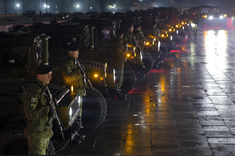Soldiers of Kosovo Security Force line up to displaying their equipment at the end of the army formation ceremony in capital Pristina, Kosovo on Friday, Dec. 14, 2018. Kosovo's parliament convened on Friday to approve the formation of an army, a move that has angered Serbia which says it would threaten peace in the war-scarred region. (AP Photo/Visar Kryeziu)