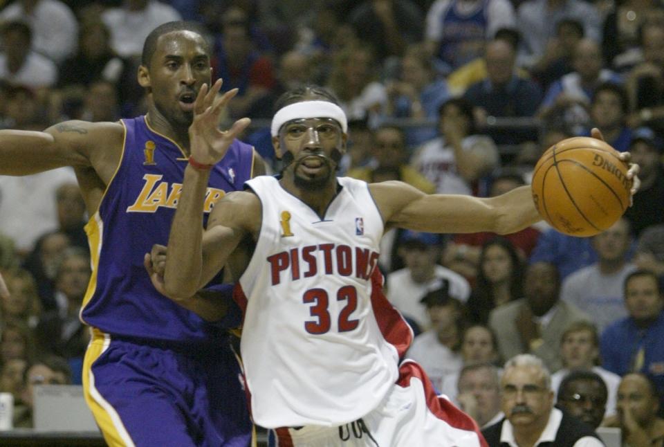 Detroit Pistons' Richard Hamilton drives past Los Angeles Lakers' Kobe Bryant during Game 3 of the NBA Finals, Thursday, June 10, 2004, at the Palace of Auburn Hills.