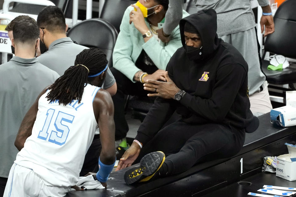 Los Angeles Lakers forward LeBron James talks to Los Angeles Lakers center Montrezl Harrell (15) 