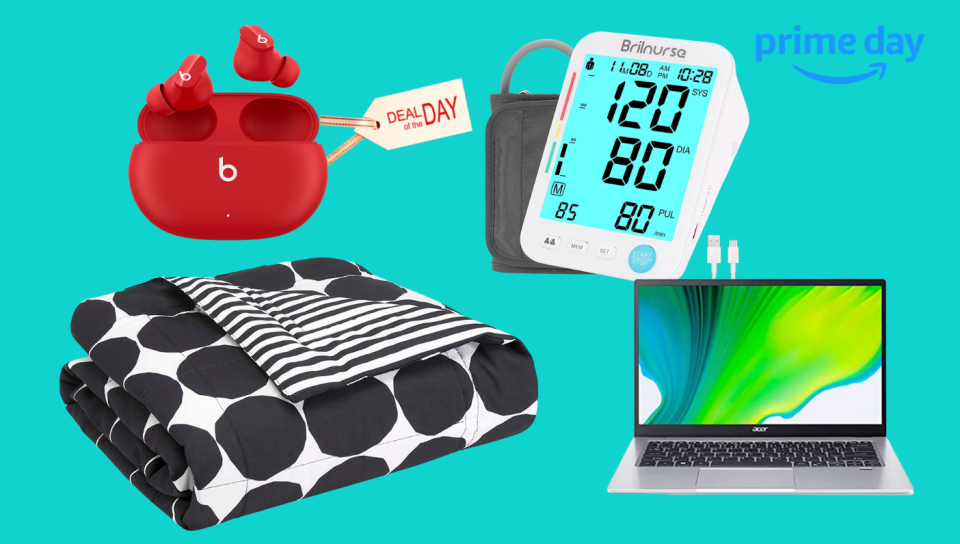A photo showing earbuds, duvet, blood pressure monitor and a laptop.