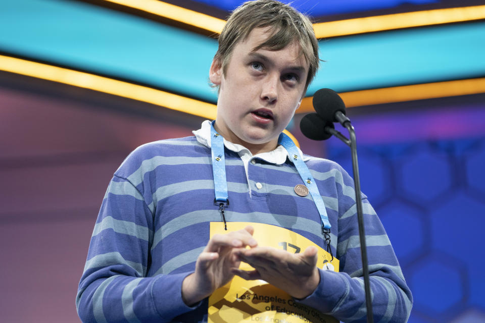 Oliver Halkett, 12, Los Angeles, Calif., works out the parts of his word before misspelling during the quarterfinal round of competition in the Scripps National Spelling Bee, in Oxon Hill, Md., Wednesday, May 29, 2024. (AP Photo/Nathan Howard)