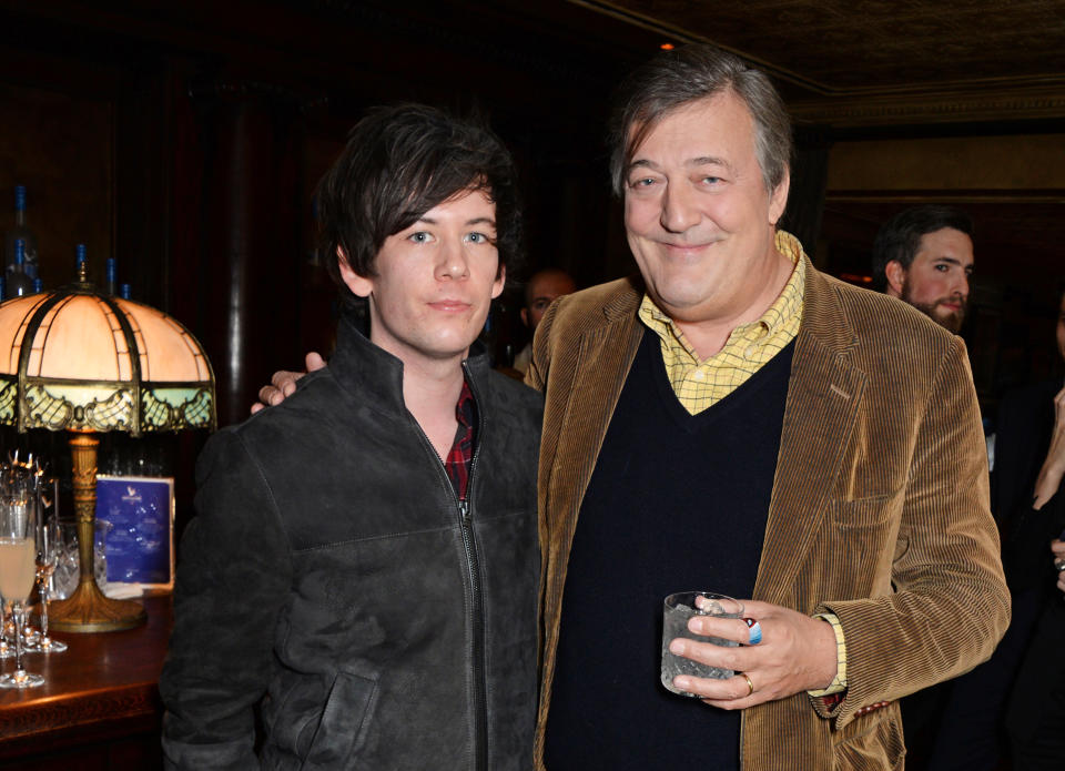 LONDON, ENGLAND - FEBRUARY 06:  Elliot Spencer (L) and Stephen Fry attend Harvey Weinstein's BAFTA Dinner in partnership with Burberry & GREY GOOSE at Little House Mayfair on February 6, 2015 in London, England.  (Photo by David M. Benett/Getty Images for GREY GOOSE)