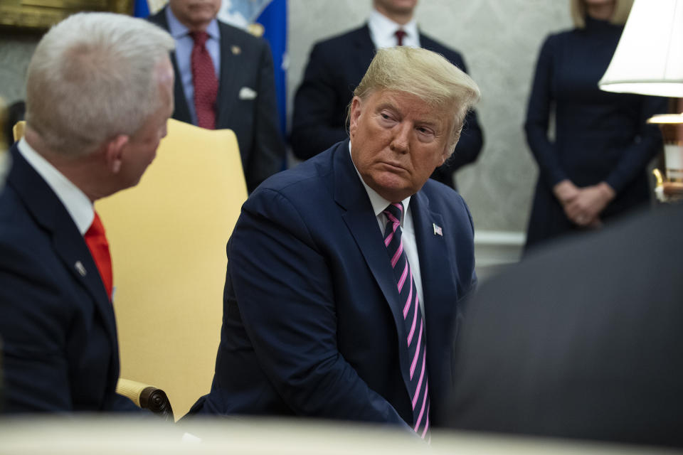 FILE - In this Dec. 19, 2019 photo, President Donald Trump, right, meets with Rep. Jeff Van Drew in the Oval Office of the White House in Washington. President Donald Trump is coming next week to the Jersey shore to reward newly minted Republican Rep. Jeff Van Drew for leaving the Democrats and opposing impeachment and is expected to attract a crowd and headlines. But Van Drew has also been crisscrossing the district to secure support from local GOP that he spent years fighting. (AP Photo/ Evan Vucci, File)