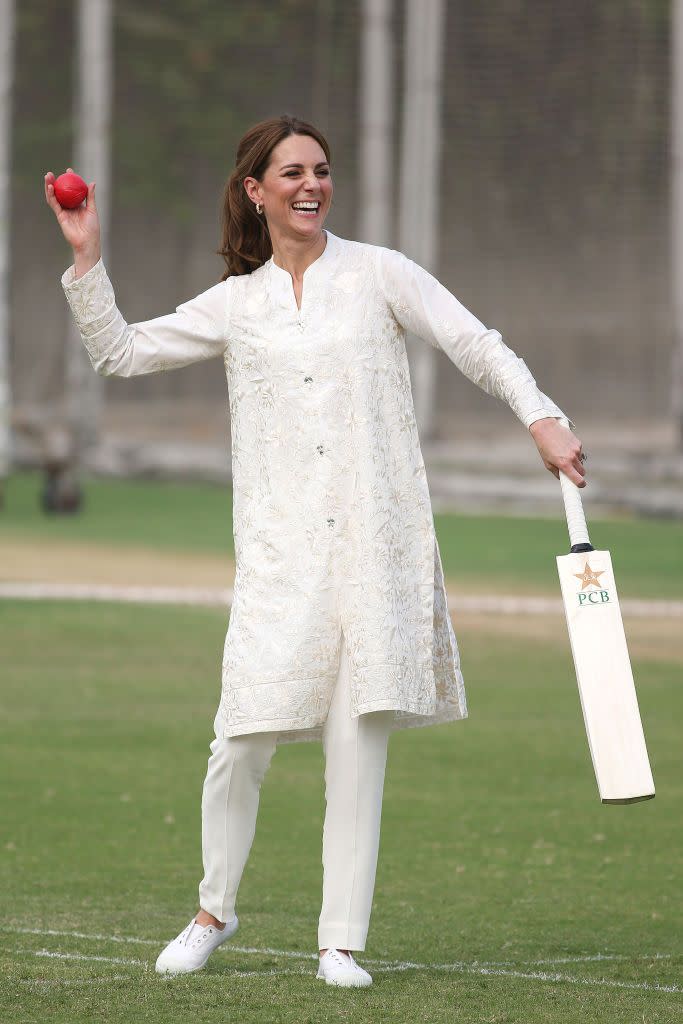 <p>On the fourth day of Kate and Prince William's royal tour of Pakistan, the royal couple visited the National Cricket Academy, and even tried to play the sport. For the casual event, the Duchess paired sneakers with a shalwar kameez by Gul Ahmed.</p>