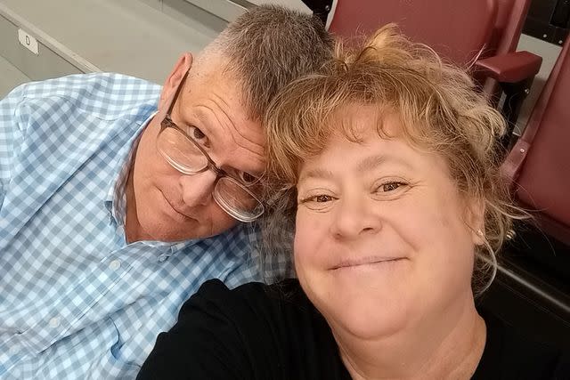 <p>Courtesy of Elizabeth Gross</p> Marc Gross, left, and Elizabeth Gross on the bleachers where Elizabeth took her fall