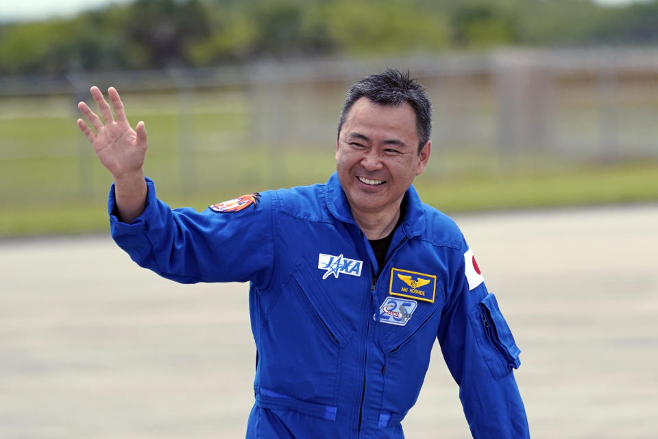 SpaceX Crew 2 member Japan Aerospace Exploration Agency astronaut Akihiko Hoshide waves after a news conference at the Kennedy Space Center in Cape Canaveral, Fla., Friday, April 16, 2021 as he prepares for a mission to the International Space Station. The launch is targeted for April 22. (AP Photo/John Raoux)