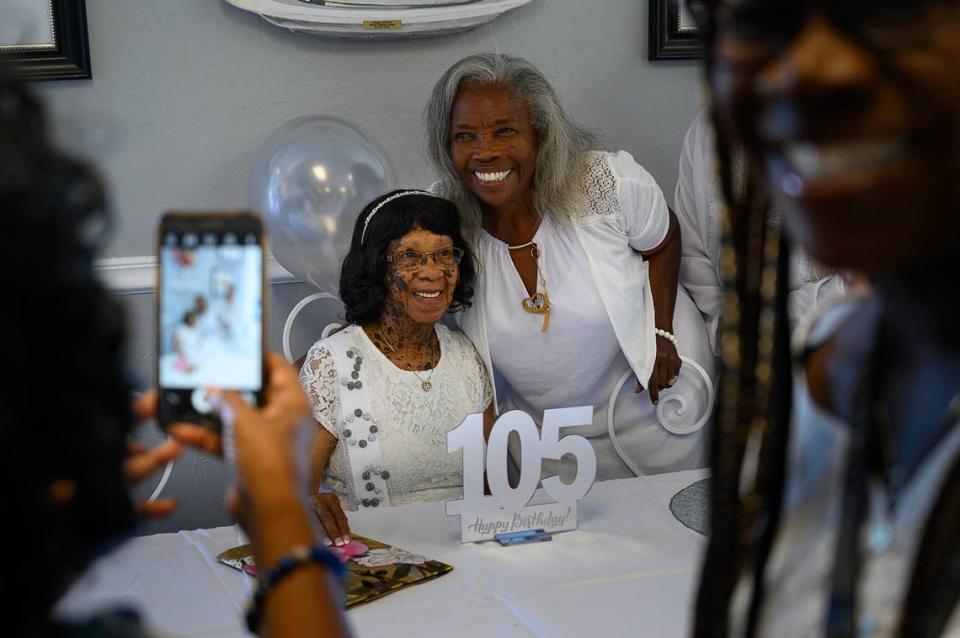 Barbara Holman-Robinson poses for photographs as she celebrates her 105th birthday with family members and friends at Leatherby’s Family Creamery on Monday, July 15, 2019 in Sacramento.