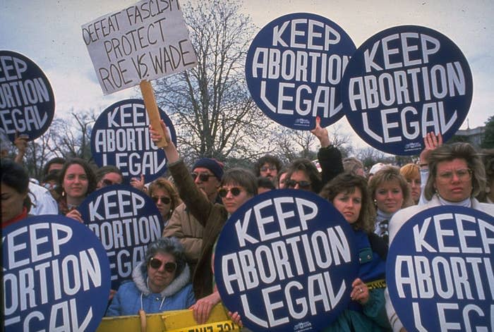 Protesters with "Keep abortion legal" signs in the late '80s