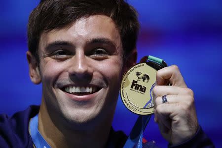 Diving – 17th FINA World Aquatics Championships – Men's 10m Platform awarding ceremony – Budapest, Hungary – July 22, 2017 – Tom Daley of Britain (gold) poses with the medal. REUTERS/Stefan Wermuth