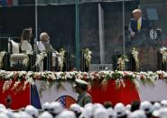 U.S. President Donald Trump addresses the audience as Indian Prime Minister Narendra Modi and U.S. first lady Melania Trump watch during the "Namaste Trump" event at Sardar Patel Gujarat Stadium, in Ahmedabad