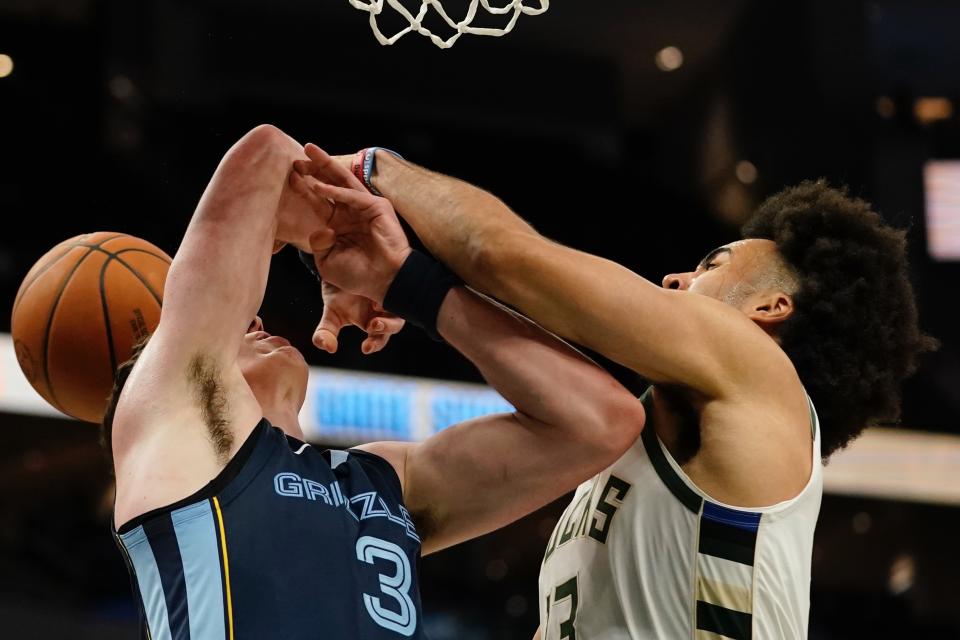 Milwaukee Bucks' Jordan Nwora fouls Memphis Grizzlies' Jake LaRavia during the second half of an NBA preseason basketball game Saturday, Oct. 1, 2022, in Milwaukee. (AP Photo/Morry Gash)