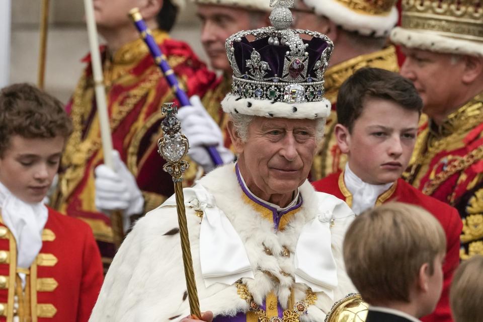 FILE - Britain's King Charles III departs Westminster Abbey after his coronation ceremony in London Saturday, May 6, 2023. At an age when many of his contemporaries have long since retired, King Charles III is not one to put his feet up. The king will mark his 75th birthday on Tuesday, Nov. 14, 2023, by highlighting causes close to his heart. With Queen Camilla at his side, Charles will visit a project that helps feed those in need by redistributing food that might otherwise go to landfills. (AP Photo/Alessandra Tarantino, File)