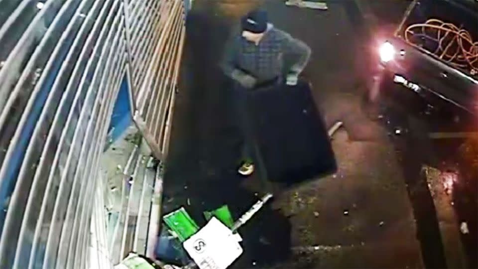 One of the men entered the store after the ute created an opening. Photo: Victoria Police