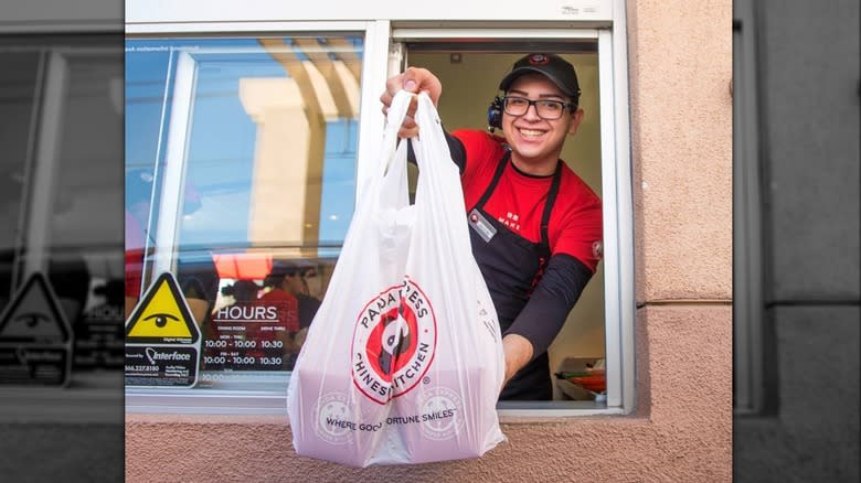 Panda Express worker holding bag