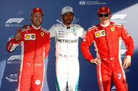 Formula One F1 - Australian Grand Prix - Melbourne Grand Prix Circuit, Melbourne, Australia - March 24, 2018 Mercedes' Lewis Hamilton celebrates pole position after qualifying with Ferrari's Sebastian Vettel and Kimi Raikkonen REUTERS/Brandon Malone