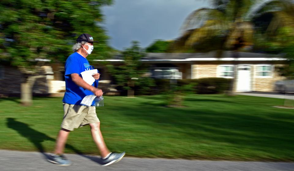 Democratic Party volunteers along with Bob McCaa have been coordinating "no knock" no contact door-to-door canvassing efforts where he and local volunteers drop off information on voting and the candidates. Here McCaa, canvassing the Ayres Point neighborhood in north east Bradenton on Wednesday afternoon, Oct. 28, 2020.