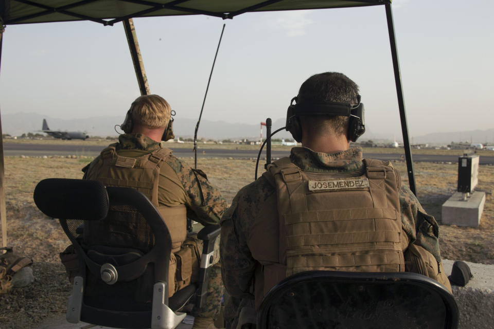 In this image provided by the U.S. Marine Corps, Marines assigned to the 24th Marine Expeditionary Unit monitor the air traffic control center at Hamid Karzai International Airport in Kabul, Afghanistan, Sunday, Aug. 22, 2021.  / Credit: Cpl. Davis Harris / AP