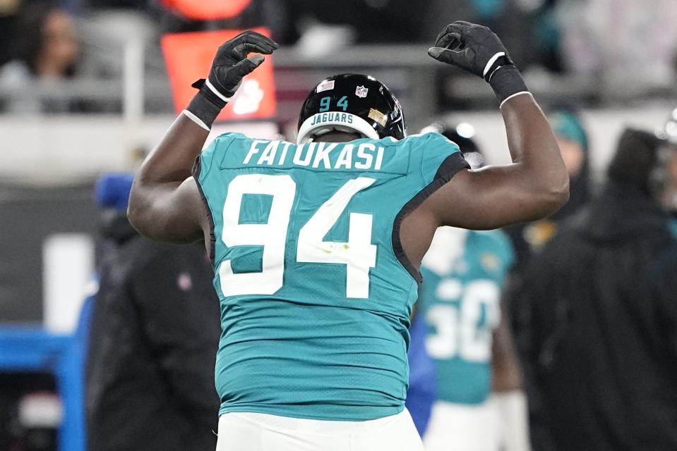 Jacksonville Jaguars defensive tackle Folorunso Fatukasi (94) reacts to a penalty during the second half of an NFL wild-card football game against the Los Angeles Chargers, Saturday, Jan. 14, 2023, in Jacksonville, Fla. (AP Photo/Chris Carlson)