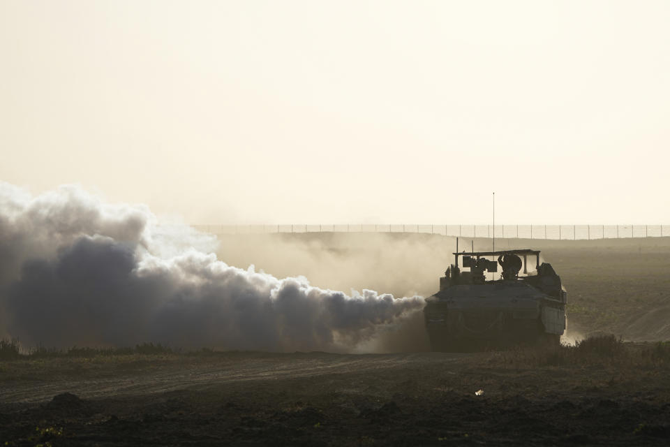 Israeli troops move near the Gaza Strip border in southern Israel, Monday, March 4, 2024. The army is battling Palestinian militants across Gaza in the war ignited by Hamas' Oct. 7 attack into Israel. (AP Photo/Ohad Zwigenberg)