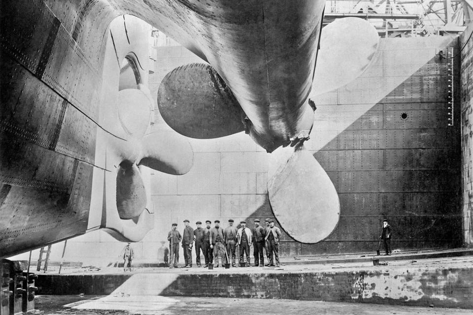 Vintage photo featuring the RMS Titanic's propellers as the ship sits in dry dock.