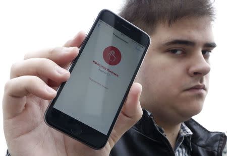 Alexander Litreev, developer of the "Red Button" phone application used to tackle police detention of protesters at demonstrations across the country, poses for a picture in Moscow, Russia, April 26, 2017. REUTERS/Sergei Karpukhin